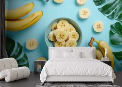 Fresh sliced banana fruit in a bowl on wooden table closeup view Wall mural