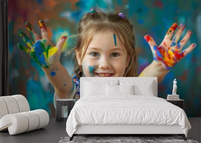 Happy little girl playing with paint Wall mural