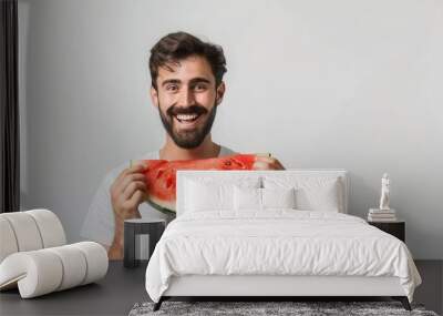 Male holding a fresh sweet ripe watermelon slice Wall mural