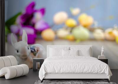 Spring Easter background on wooden board with white ceramic rabbit and colorful tulips and eggs room for text Wall mural