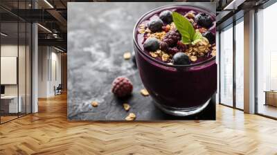 Acai smoothie is a healthy drink made with acai berries. It's often served with fruit and granola on top. Wall mural