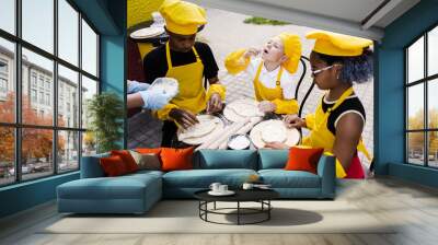 Childhood cook activity of multinational children of black african and caucasian kids. Happy company of multiethnic children cooking dough. Wall mural