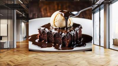 Chocolate cake with vanilla ice cream and chocolate syrup on wooden background, Brownie  Wall mural