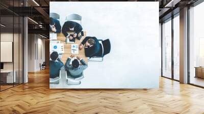 Top view on a group of businessman and businesswoman having a meeting and making a business commitment. Wall mural