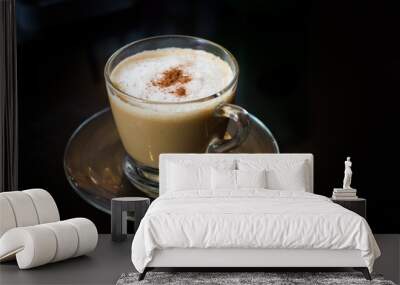 Coffee in a glass cup with black background Wall mural