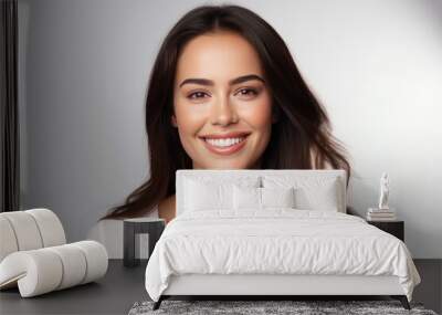 Closeup photo portrait of a beautiful young latin hispanic model woman smiling with clean teeth. Used for a dental ad. Isolated on light background. Wall mural