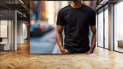 Man model shirt mockup. Boy wearing black t-shirt on street in daylight. T-shirt mockup template on hipster adult for design print. Male guy wearing casual t-shirt mockup placement. Wall mural