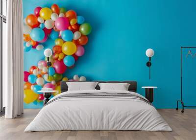 Number 2 made out of colorful balloons with a solid background. Age, anniversary, birthday, party celebration background. Wall mural