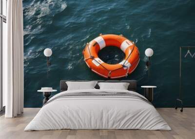 Safety equipment, Life buoy or rescue buoy floating on sea to rescue people from drowning man. Wall mural