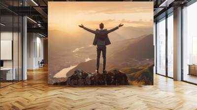 Silhouette of successful businessman keeping hands up hiking on the top of mountain. Celebrating success, winner and leader concept. Wall mural