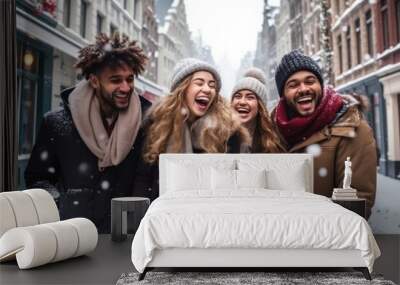 Smiling portrait of young group of student friends enjoying time together on winter city. Young adult people having fun during christmas vacation outdoors. Wall mural