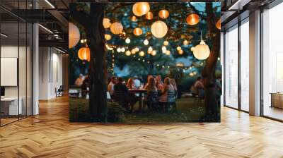 Summer garden party at twilight, lanterns hanging from trees and guests enjoying the warm night air. Wall mural