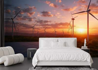 Modern Wind turbines and solar panels sunset light. Concept eco green renewable energy Wall mural