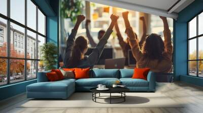 Group of euphoric business people celebrating success, raising hands with fists up, gathered around desk at modern office, Generative AI Wall mural