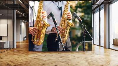 two saxophonists playing at a jazz festival in a city park Wall mural