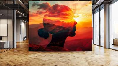 Artistic composite silhouette of a head merging with a mountainous landscape at sunset, symbolizing connection with nature Wall mural