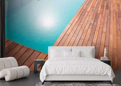 Texture with tiled wooden decorative planking, hardwood ipe pool deck shining sun reflecting on the water Wall mural