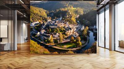 Aerial view of Esch-sur-Sure, medieval town in Luxembourg, dominated by castle, canton Wiltz in Diekirch. Forests of Upper-Sure Nature Park, meander of winding river Sauer, near Upper Sauer Lake. Wall mural