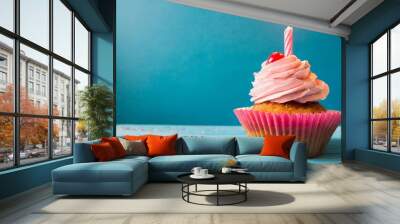 birthday cupcake on blue background cupcake on a colorful background and space for the text cupcake for birthday Wall mural