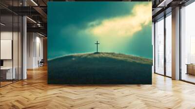 A solitary cross on the mountaintop, with light breaking through the clouds and the sun rising above the mountain, symbolizes Christian faith and grace. Wall mural