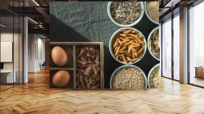 Bowl with healthy whole-grain carbohydrates and eggs, kamut, seeds, oats, brown rice, spaghetti Wall mural