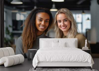 Smiling multiethnic businesswomen standing at office while looking at camera Wall mural