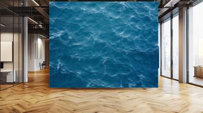 Top view of blue frothy sea surface. Shot in the open sea from above. Wall mural