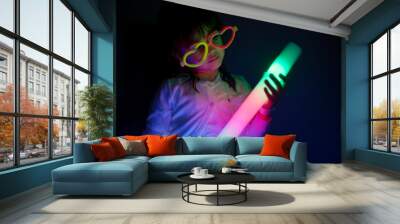 Little girl play with colorful lights Wall mural