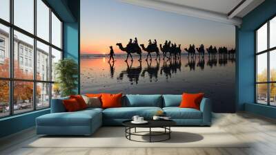 Silhouette of tourists on camel ride Cable Beach Broome Kimberley Western Australia Wall mural