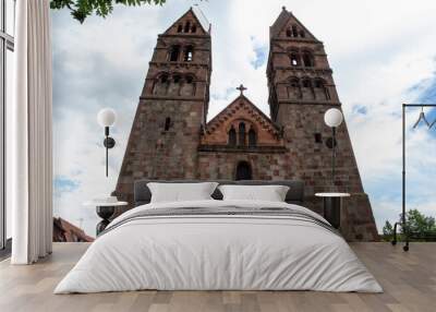 Church with two towers in a French village in the Alsace area Wall mural