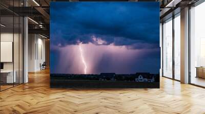 A huge storm cloud with a wall of rain in the countryside and big lightning.
 Wall mural