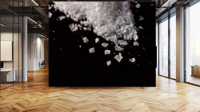 flakes of  crisp maldon crystals salt on a black surface Wall mural