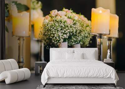 Wedding table with bouquet of white roses and burning candle .Evening Photo Wall mural