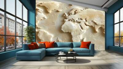 A relief sculpture of the world map, with relief details on different landmasses and oceans, all in shades of beige and white. The background is a solid color Wall mural