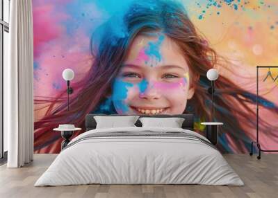 A young girl with long brown hair, smiling and covered in colorful powder, celebrating the Holi festival.  Wall mural