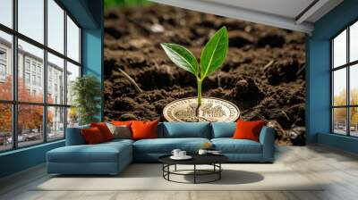 a small plant growing on a coin lying on the ground. Green investment concept, Collecting money to invest. Financial growth concept Wall mural