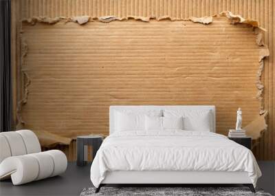 Torn cardboard piece revealing corrugated texture background Wall mural