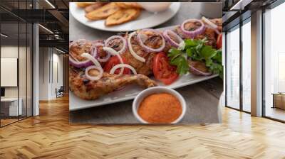 Grilled chicken with red onions. African food meal. Nigerian national dish. Fresh and healthy with tomatoes and red onions. Fried food. Fresh salad with peppers Cuisine Wall mural