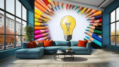 Light bulb with colorful pencils on wood background.
 Wall mural