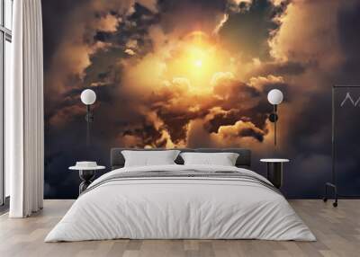 Flying through picturesque sunny cloudscape. Amazing of soft golden clouds moving in pure sunshine and the sun glowing through the clouds with beautiful rays and lens flare. Wall mural