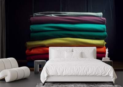 A neatly folded stack of colorful t - shirts on a shelf. created with Generative AI technology Wall mural