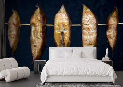 smoked pieces of halibut hanging in a smoking oven Wall mural