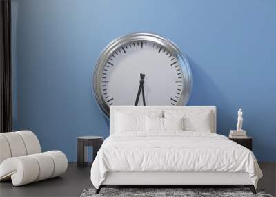 Glossy chrome clock on a blue wall at twenty-nine past six. Time is 06:29 or 18:29 Wall mural