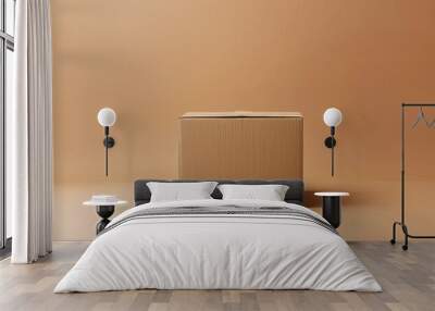 A single, simple cardboard box against a solid light brown background Wall mural