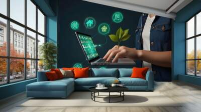 A laptop is used by the Green Tech Interface Person in denim. Wall mural