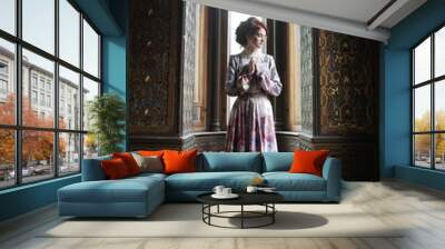  beautiful woman in pink dress posing in luxury palace Wall mural