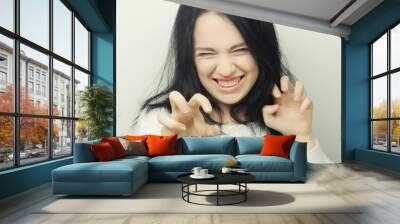 Beautiful young happy brunette woman.  Wall mural