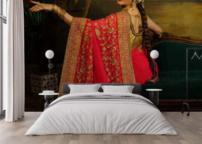 Beautiful young woman in traditional indian dress and jewelry. Wall mural