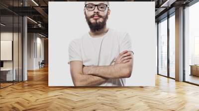 Lifestyle and people concept: Young bearded guy crossing his arms over white background Wall mural