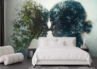 A double exposure of two women with tree silhouettes, blending human form with nature�s beauty. Wall mural